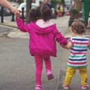TEACHING A CHILD TO WALK.