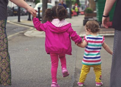 TEACHING A CHILD TO WALK.