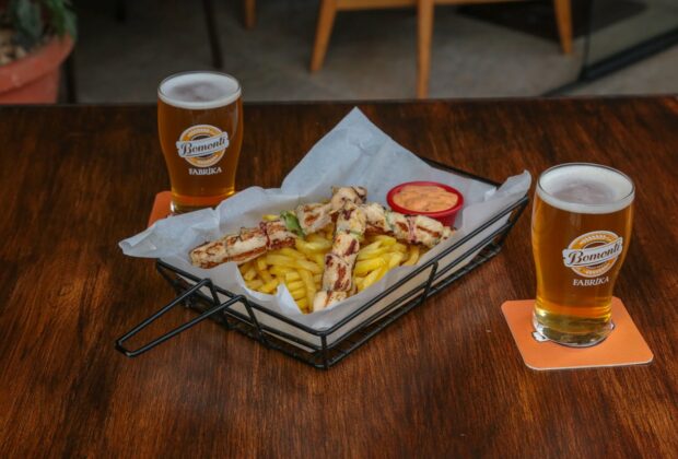 Bottles of Beer with Sausages and Fries